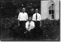 Bill Hart, Charley Stevens, and Frank Green in 1920 standing outside of church